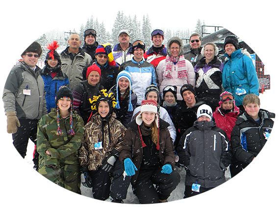 group of people in winter clothes posing for the camera