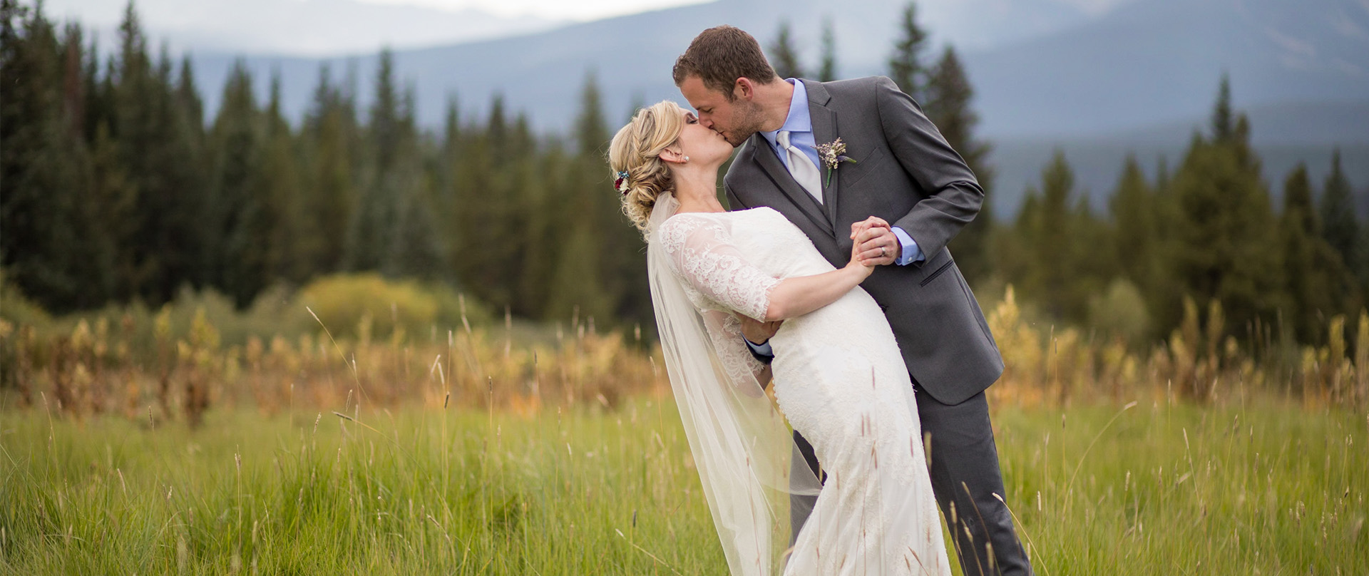 a bride and groom kissing