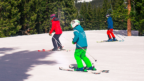 family of three skiing